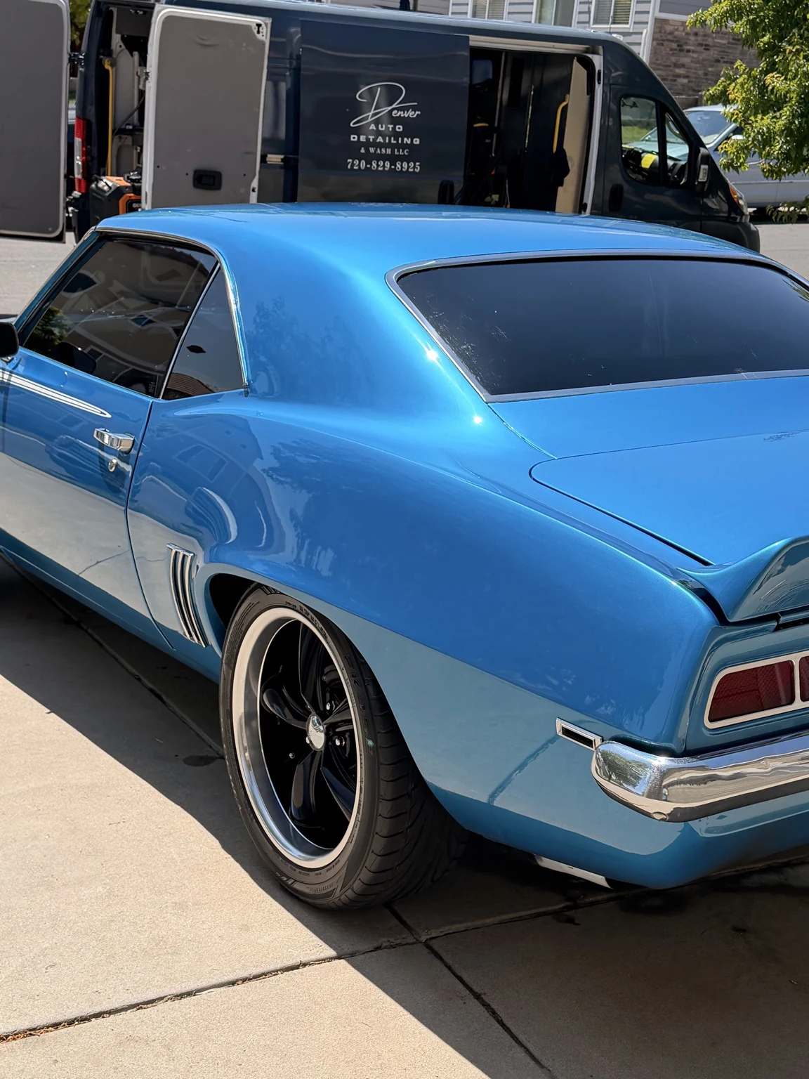 Blue classic muscle car with a high-gloss finish after detailing