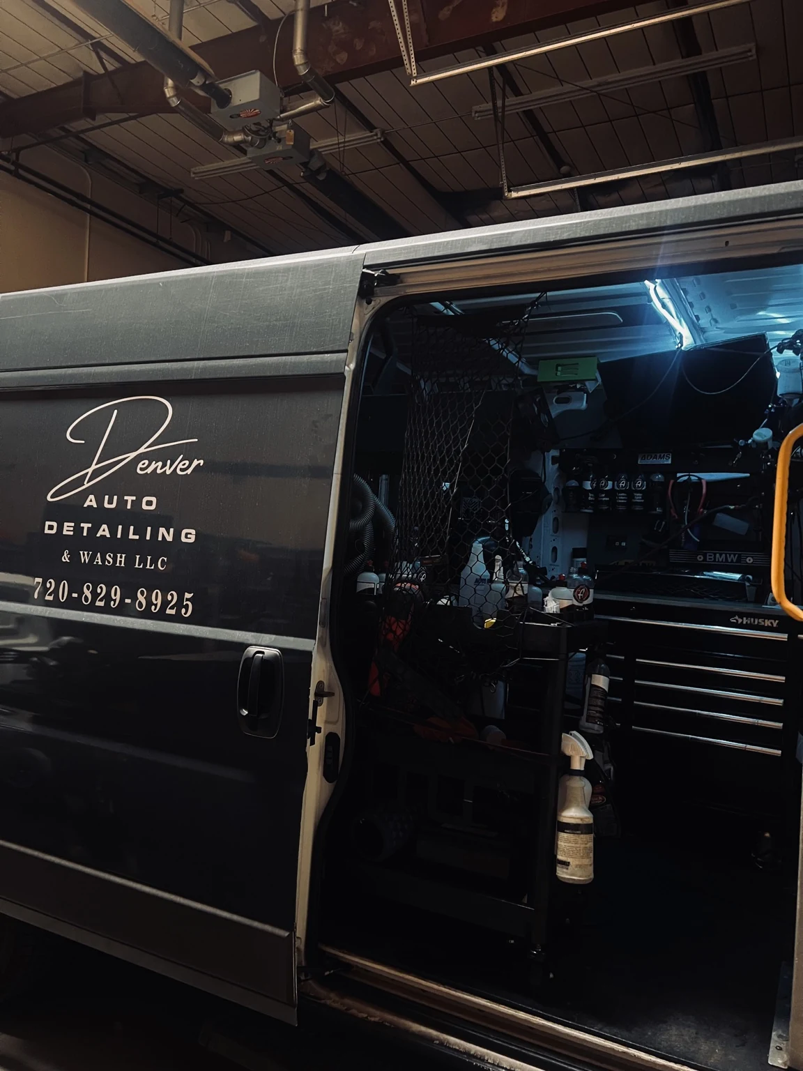 Denver Auto Detailing & Wash mobile detailing van with the side door open showing the organized setup